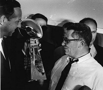 Vince Lombardi gazes at the trophy which will eventually bear his name. (?)
