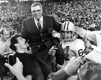 Vince Lombardi is carried off the field in victory (AP).