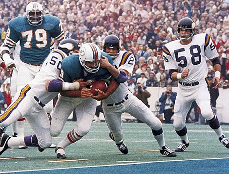 Dolphins RB Larry Csonka goes in for one of his two scores. (AP)