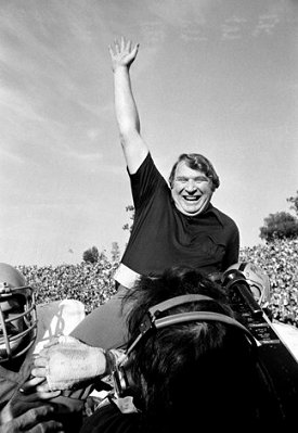 Raiders coach John Madden is carried off the field in victory. (?)