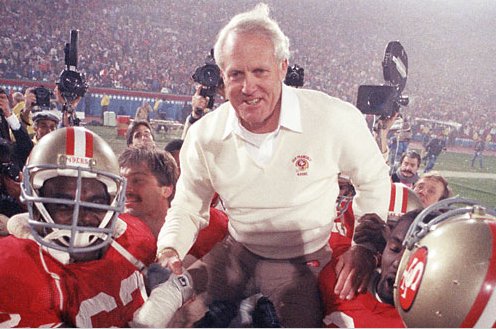 49ers head coach Bill Walsh gets carried off the field with a Super Bowl win for the second time. (AP)