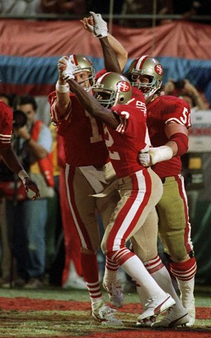 49ers QB Joe Montana, WR John Taylor and C Randy Cross celebrate Taylor's game-winning TD catch. (AP)